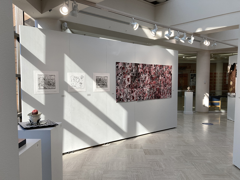 Back side of office wall next to exterior windows: Tera Peters sculpture (L) Alexia Hall prints (3) Alexia Hall print installation.